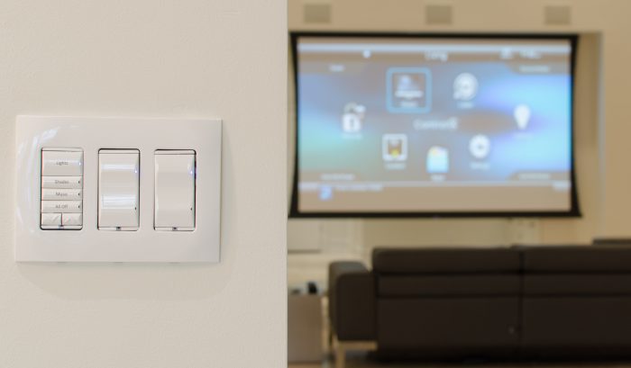 Wall-mounted lighting control keypad in a media room