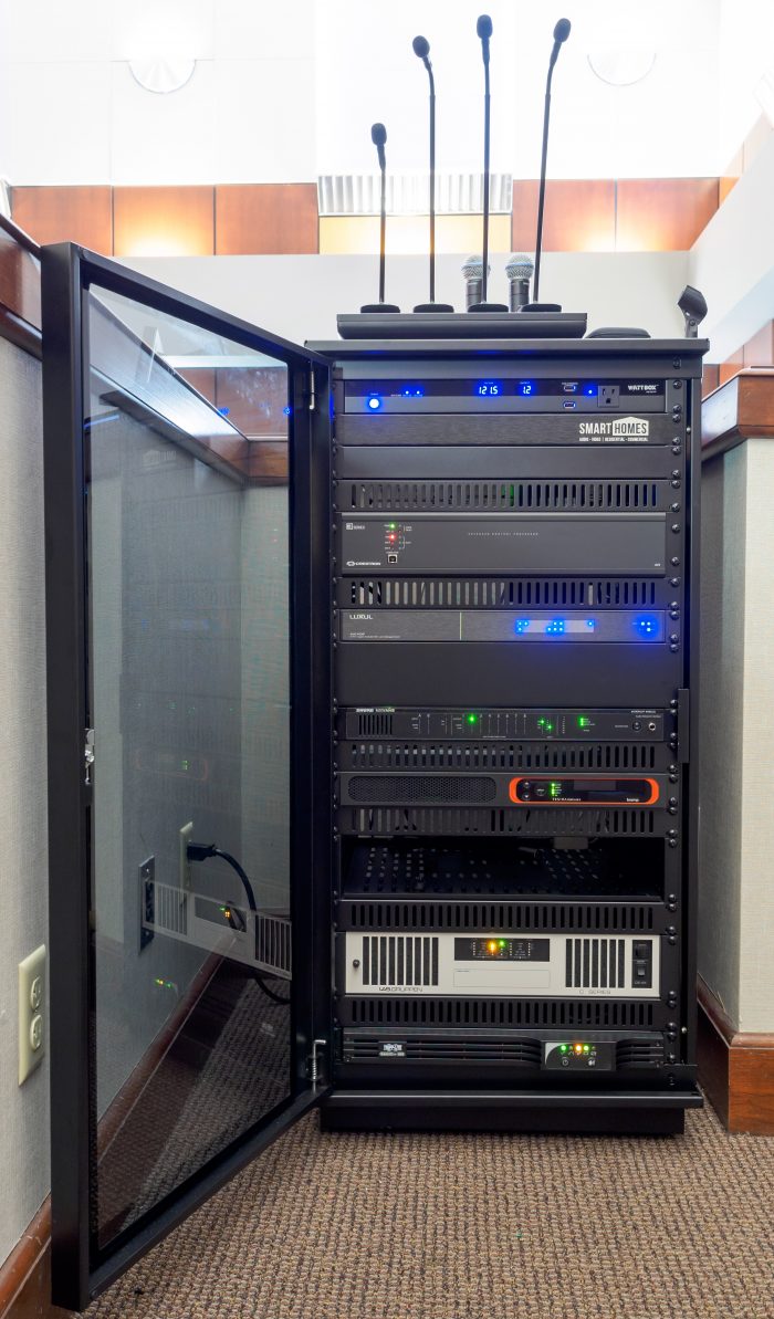 Equipment rack with a rack-mounted battery backup and network equipment